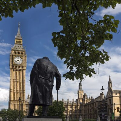 Houses Of Parliament behind the statue of Winston Churchill, London, UK.
